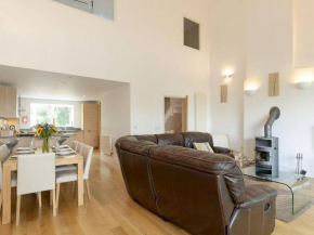 Cotswolds Lake side home with luxury spa Swallows Nest,Lower Mill Estate, Lakeside home and spa with a Harry Potter cupboard under the stairs